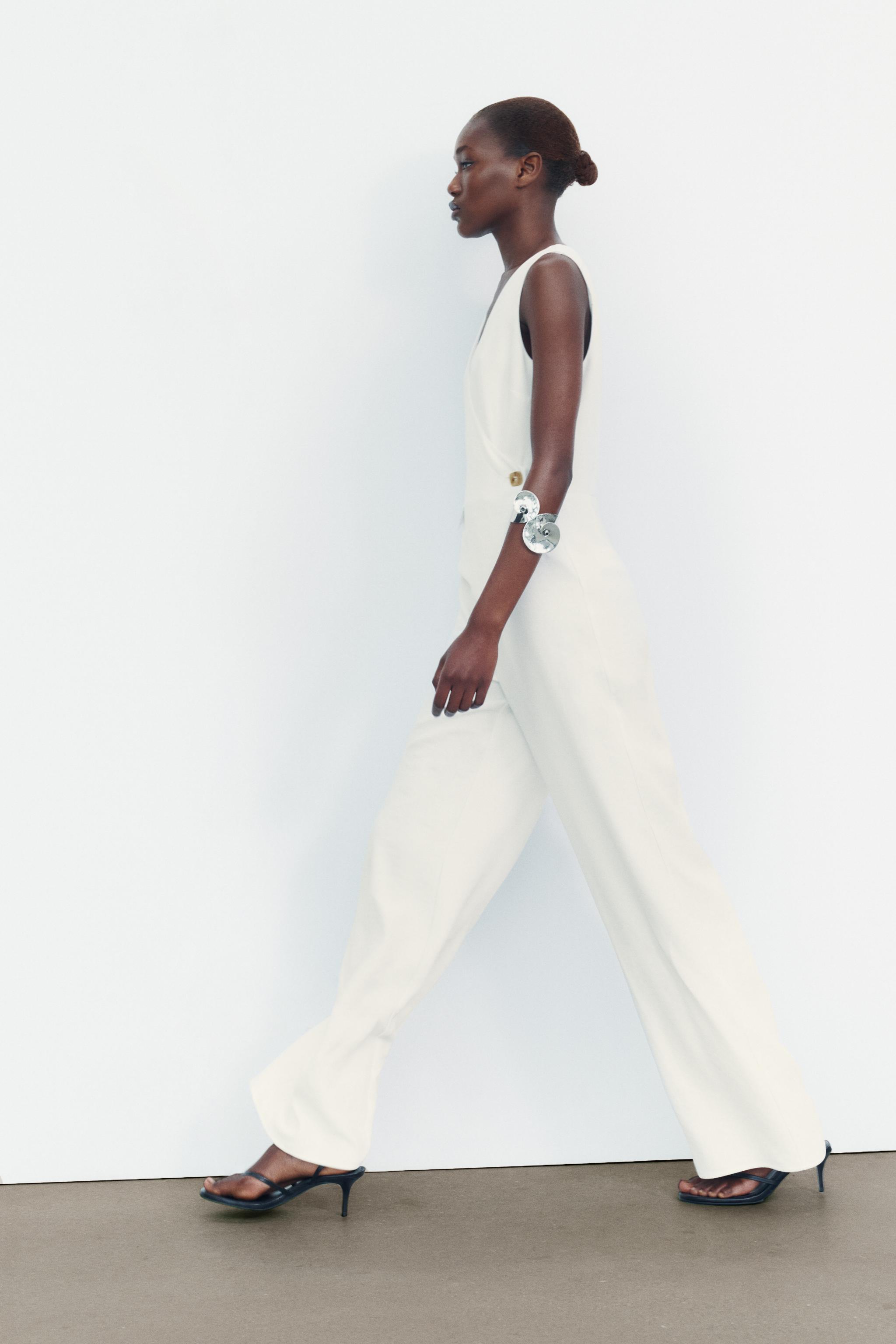 JUMPSUIT WITH ASYMMETRIC WAISTCOAT