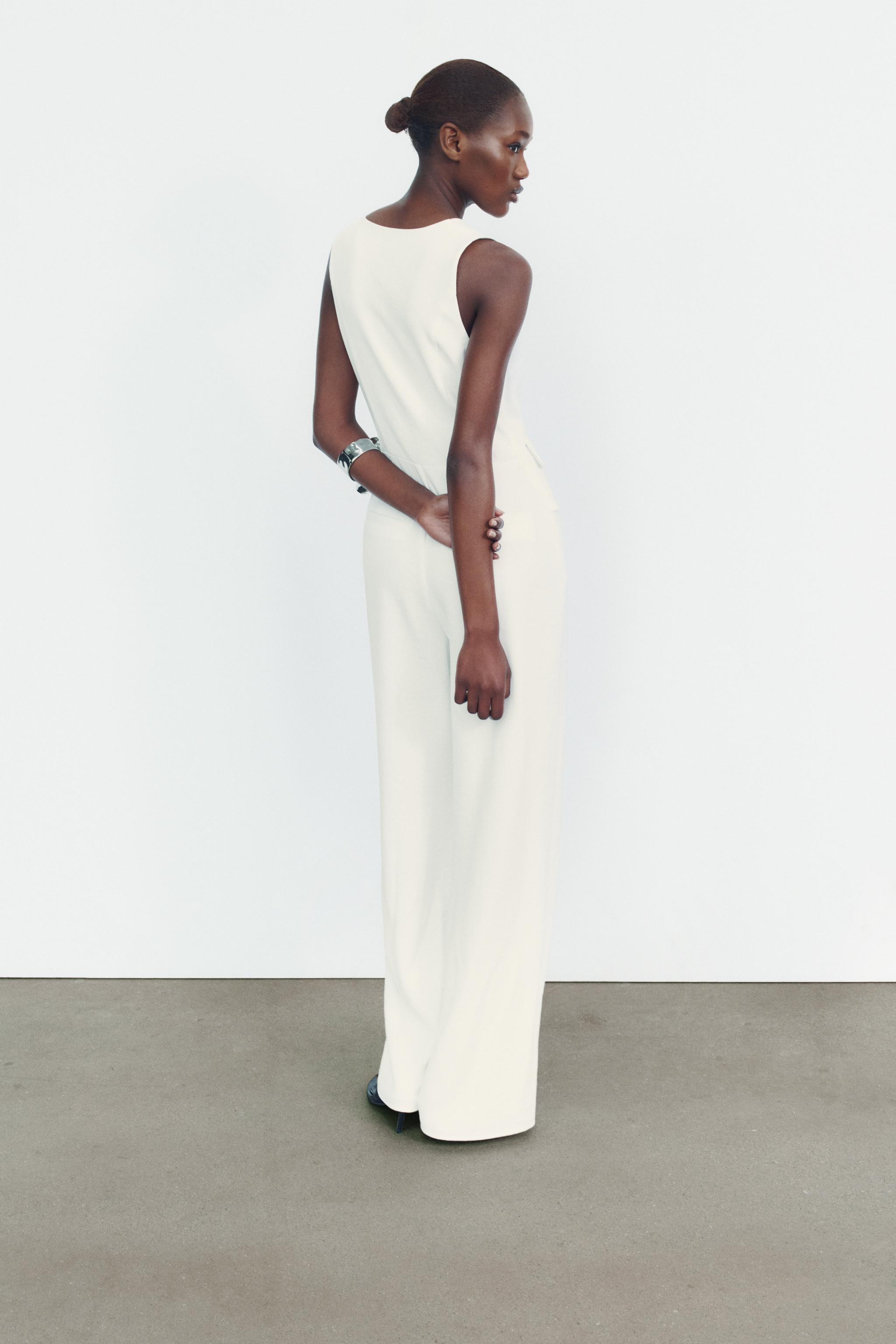 JUMPSUIT WITH ASYMMETRIC WAISTCOAT